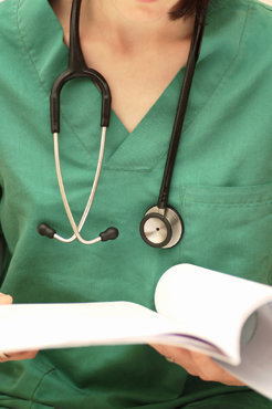 Detail of a doctor looking at a medical record