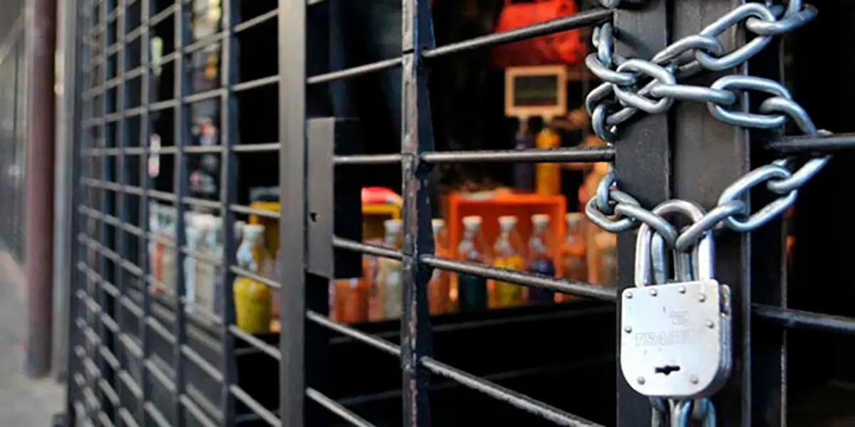 local cerrado cierre negocio crisis comercio candado cadena cadenas