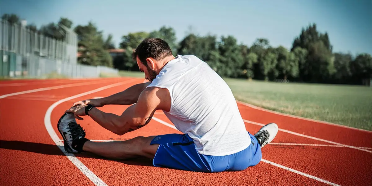estiramiento deporte atletismo running ejercicio atleta
