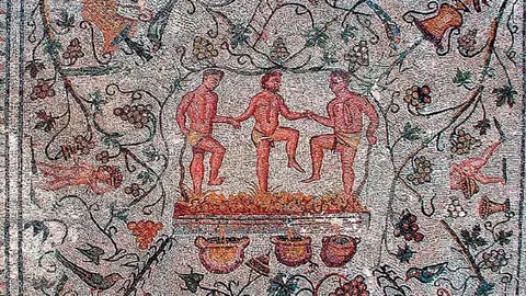 Mosaico de la Casa del Anﬁteatro en M&eacute;rida con escena de vendimia y pisa de la uva